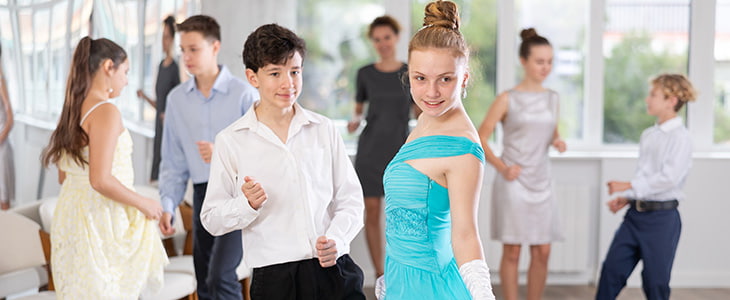 Smiling kids at a school dance