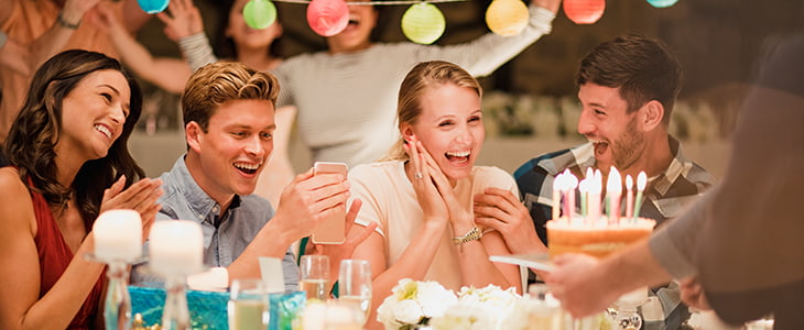 Birthday cake is served at a dinner party